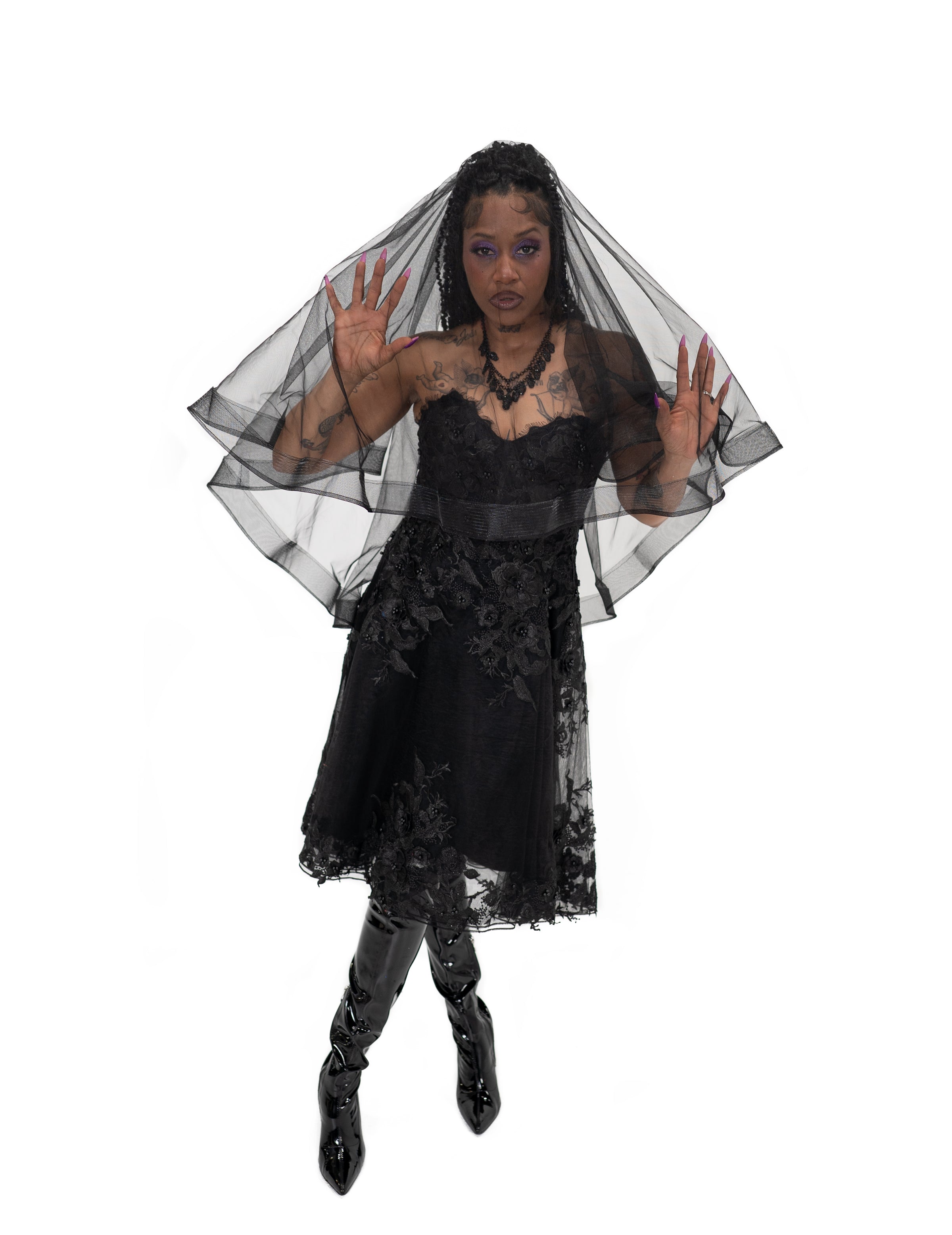 Black alternative bridal veil with layered tulle draping around the face and shoulders