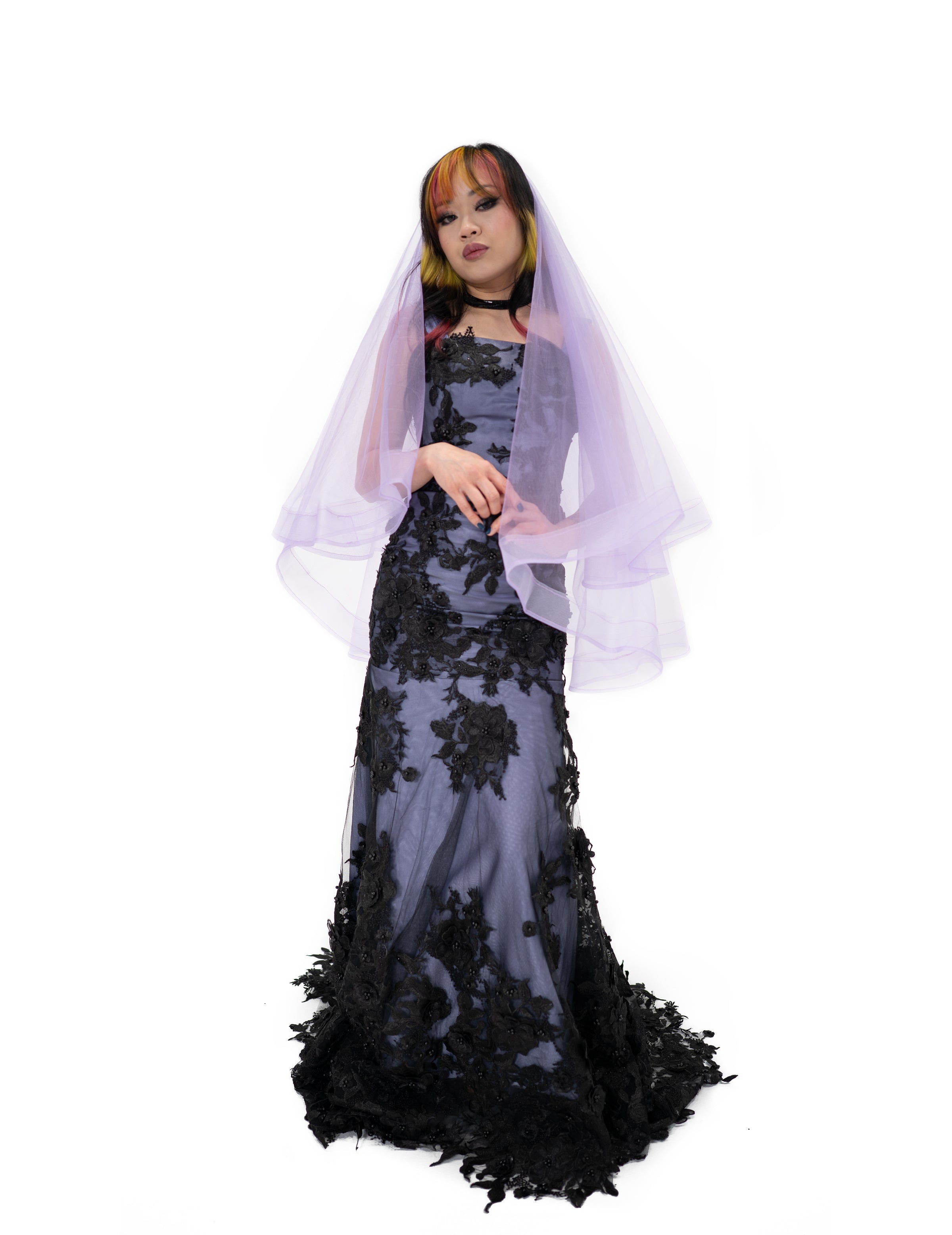 Purple gothic bridal veil by Bête Noire worn over black lace gown front view