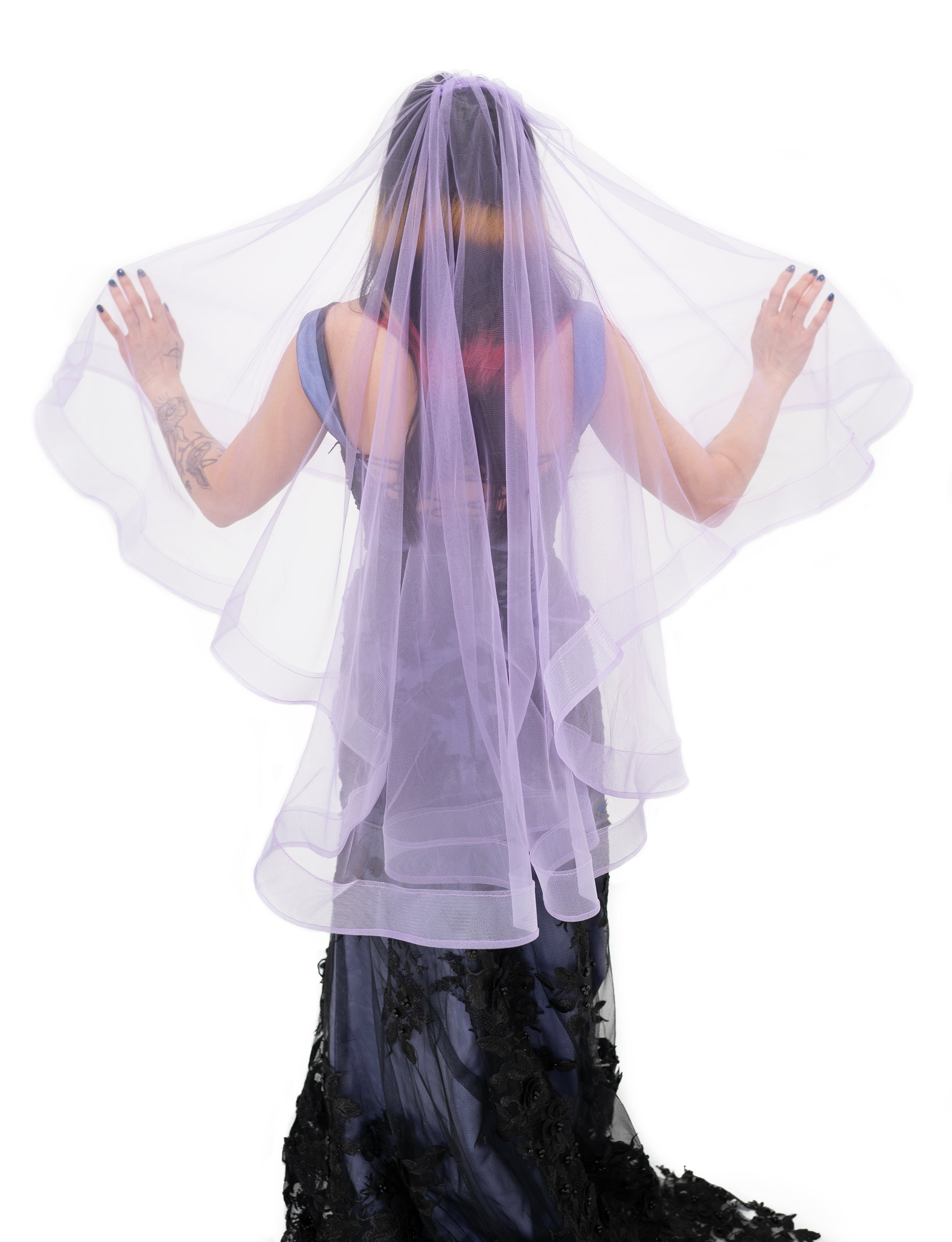 Back view of purple altar veil by Bête Noire in layered tulle