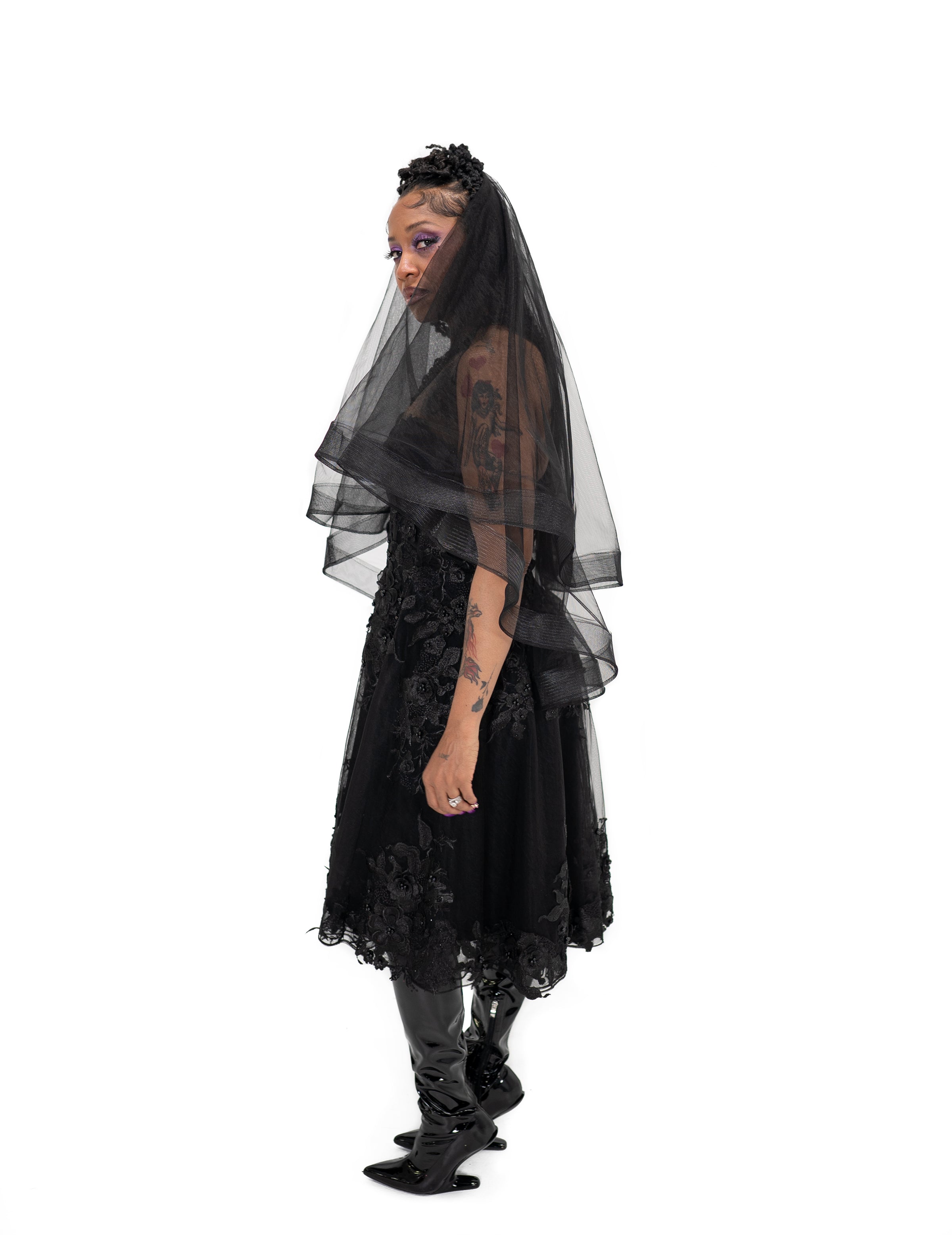 Side view of the black Altar Veil by Bête Noire with soft flowing tulle layers