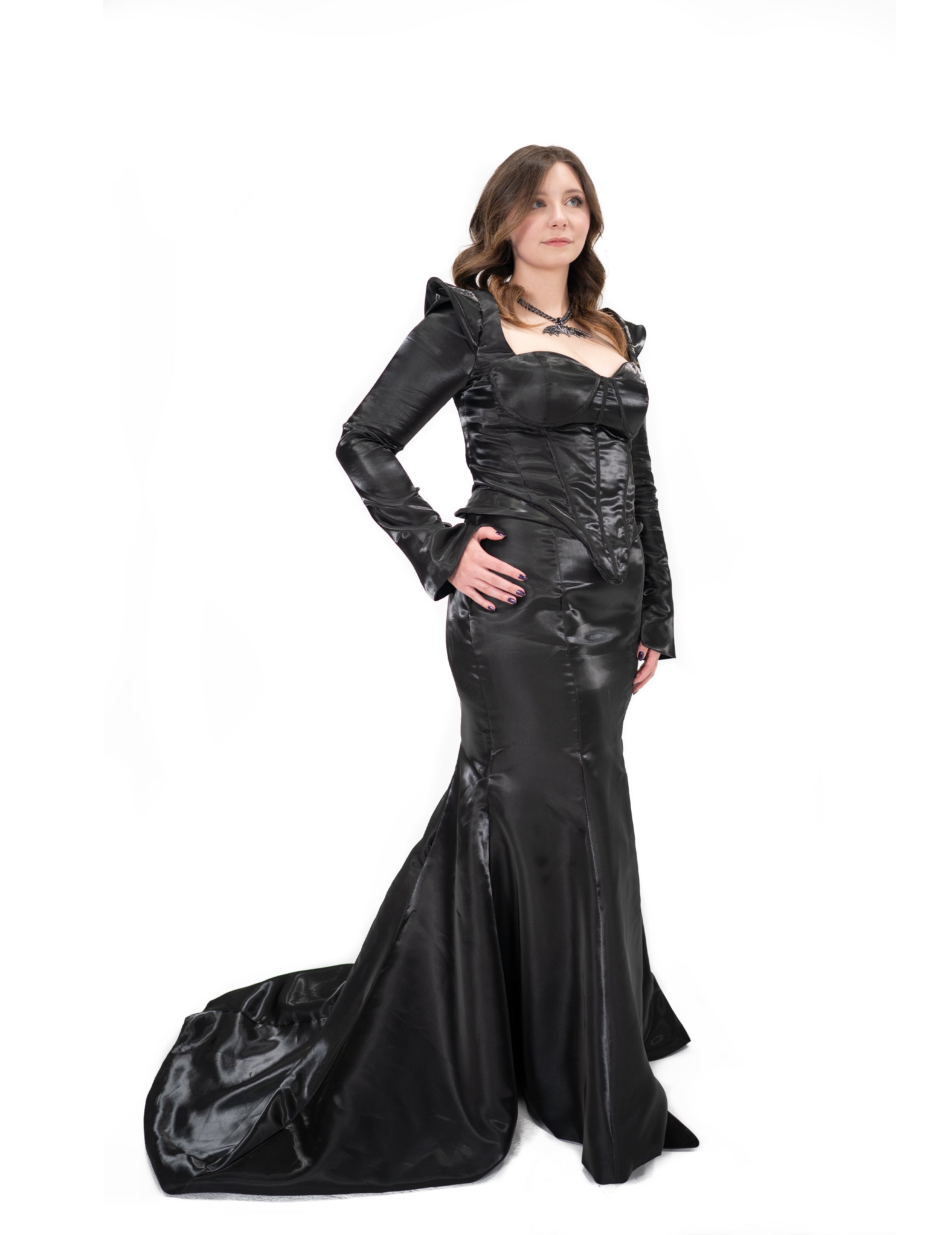 black satin gown pointed shoulders side angle