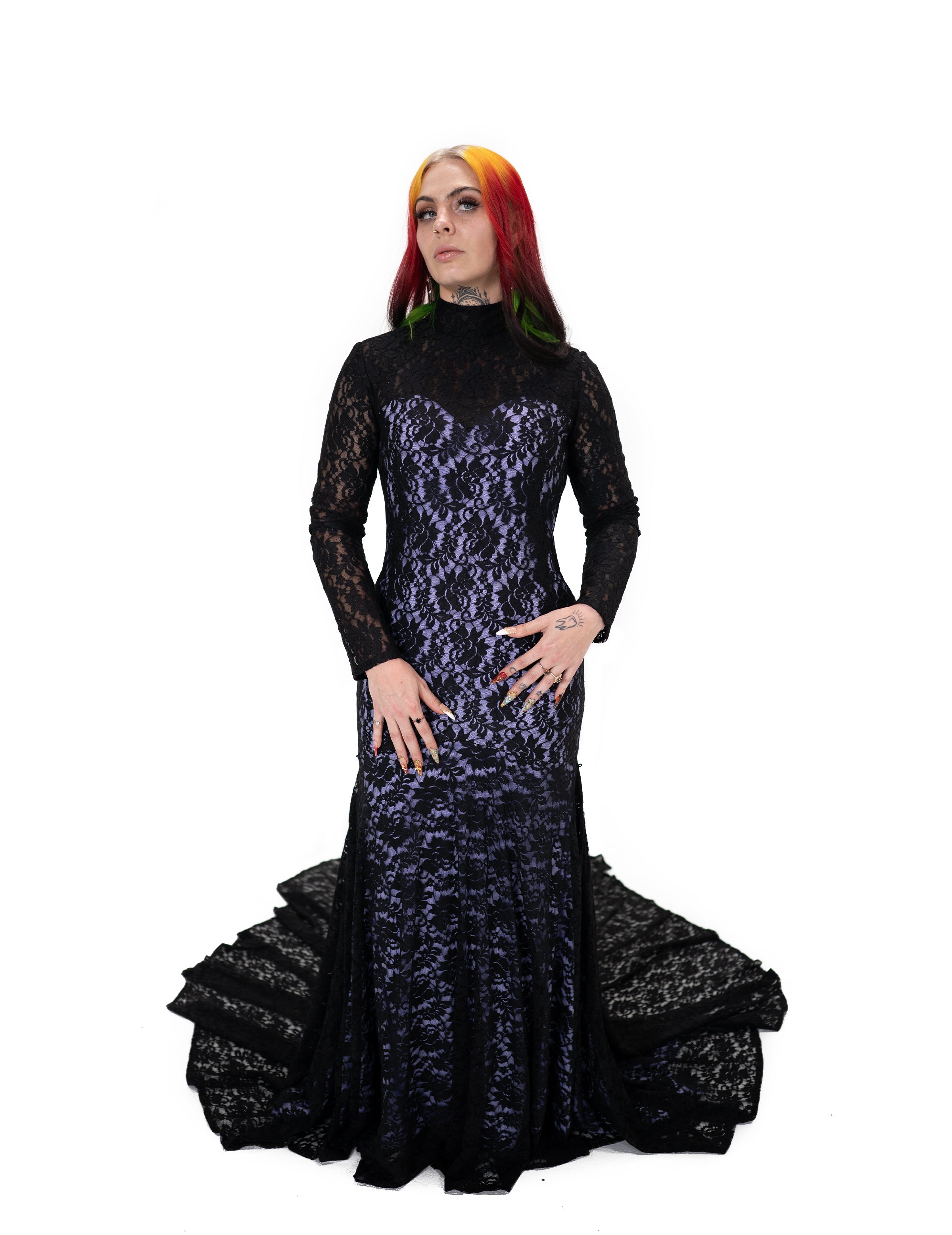 Evangeline gown by Bête Noire, black lace gown with purple underlay, high neck and long sleeves, fitted silhouette with lace train