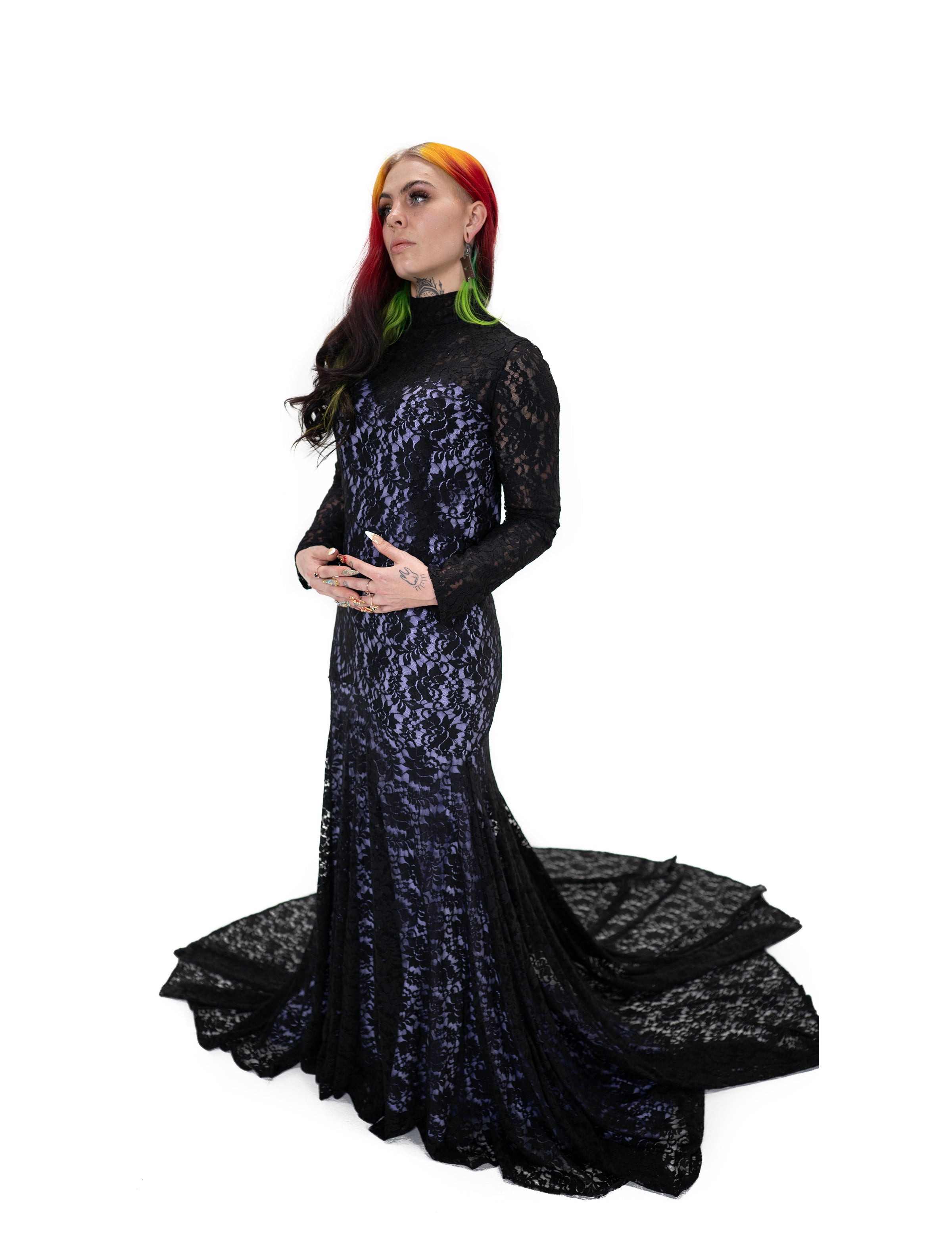 Side view of Evangeline gown by Bête Noire, black lace over purple underlay, long sleeve gothic gown with fitted shape and flared train