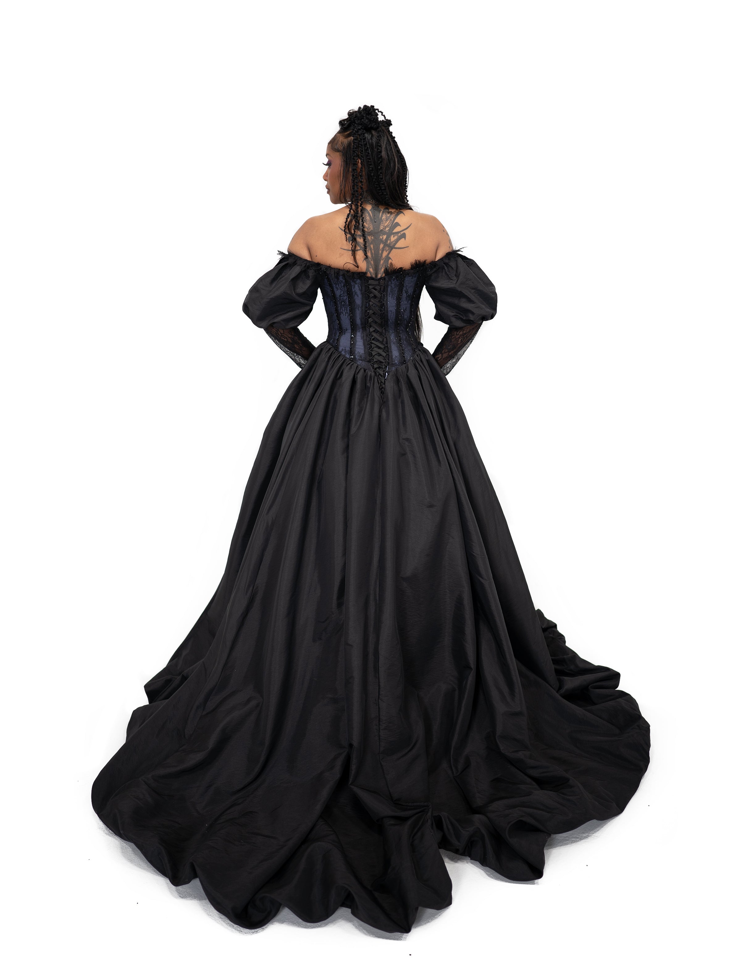 Back view of Ophelia gown by Bête Noire featuring lace up corset and dramatic full black skirt