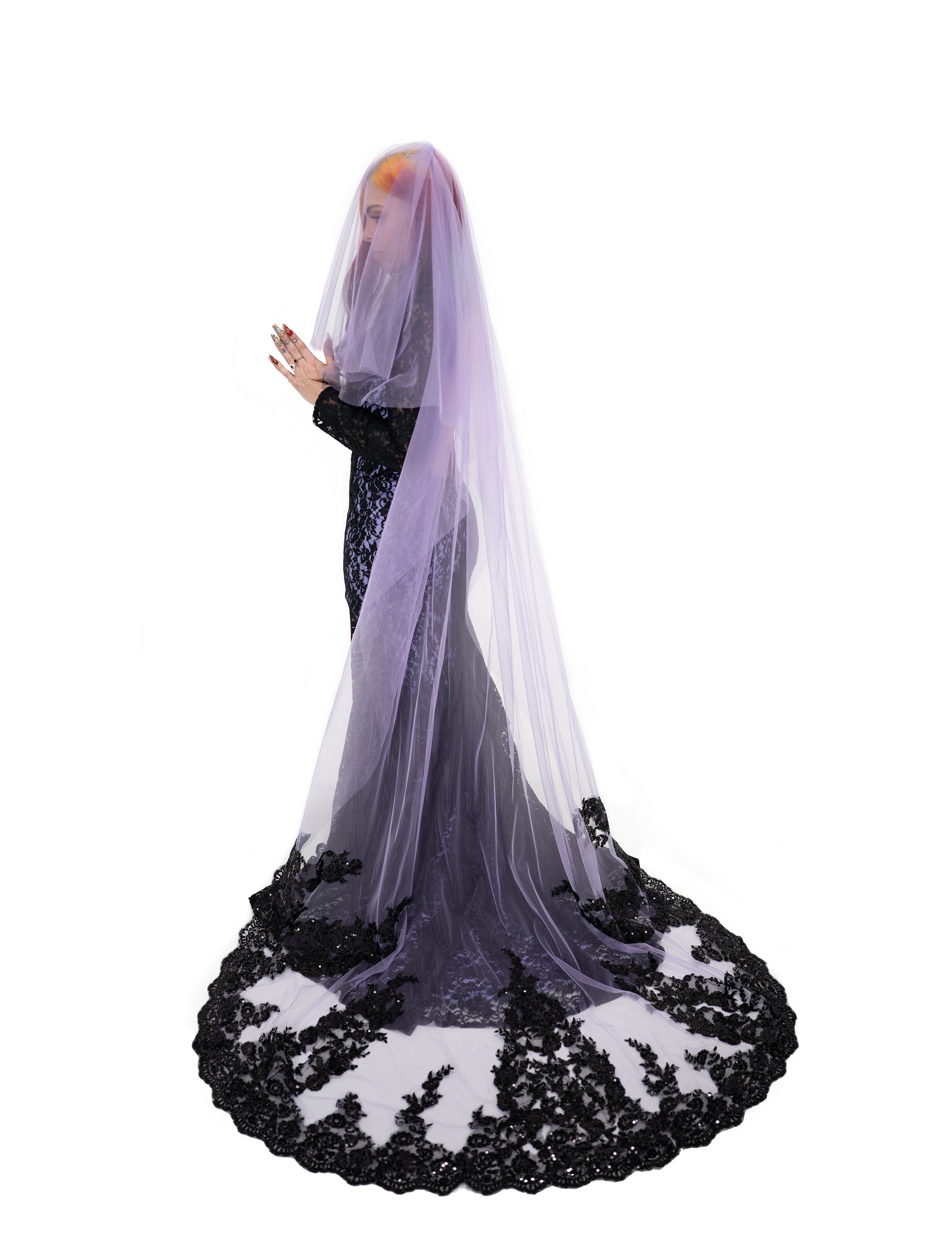 Profile view of sheer purple chapel length veil with black lace edging, soft drape