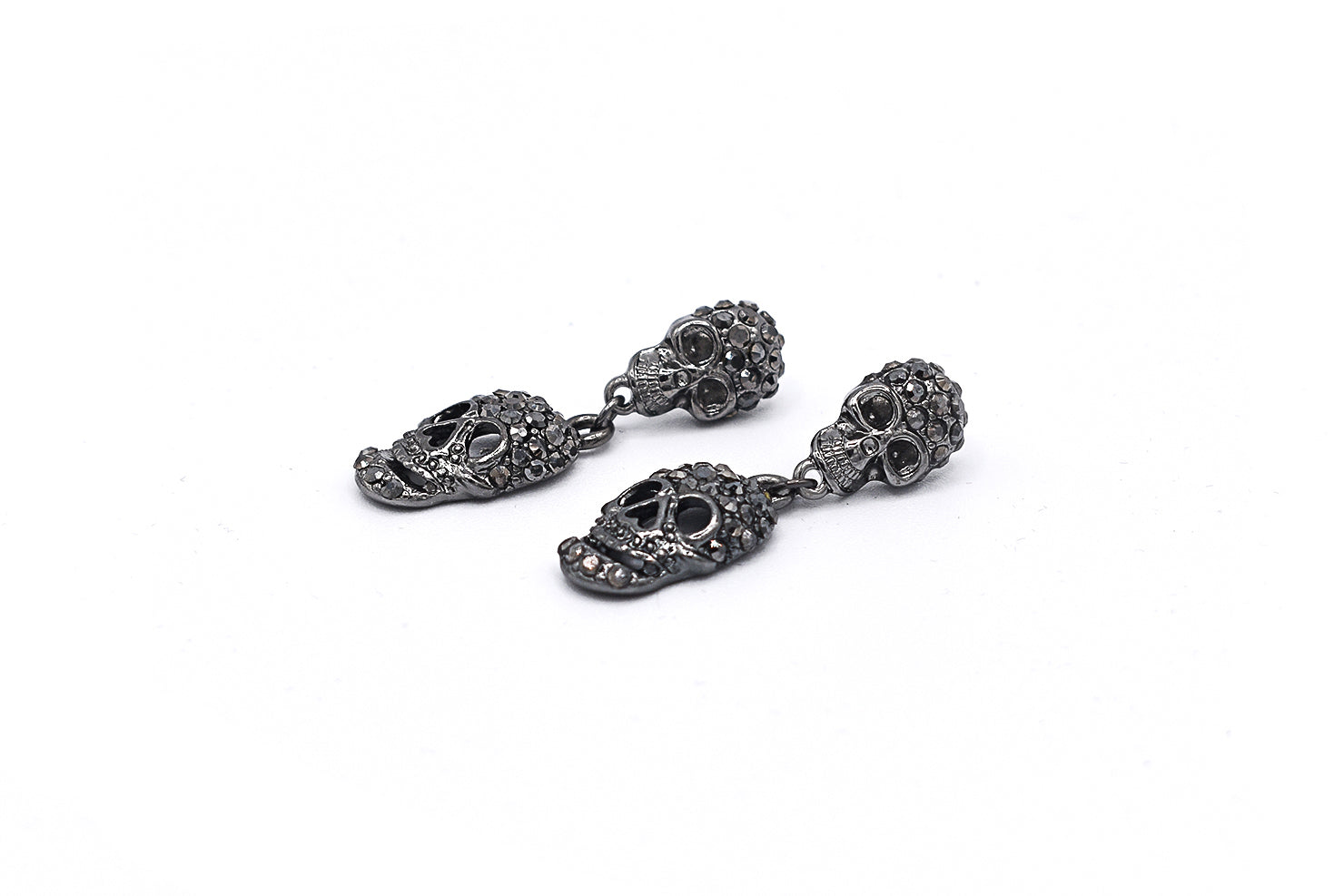 Gunmetal skull drop earrings with bold silhouette