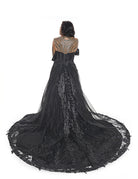 Alternative black wedding dress with dramatic sheer train and lace detailing