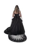 Gothic bridal veil in black tulle with lace trim, shown from the back with full length and volume