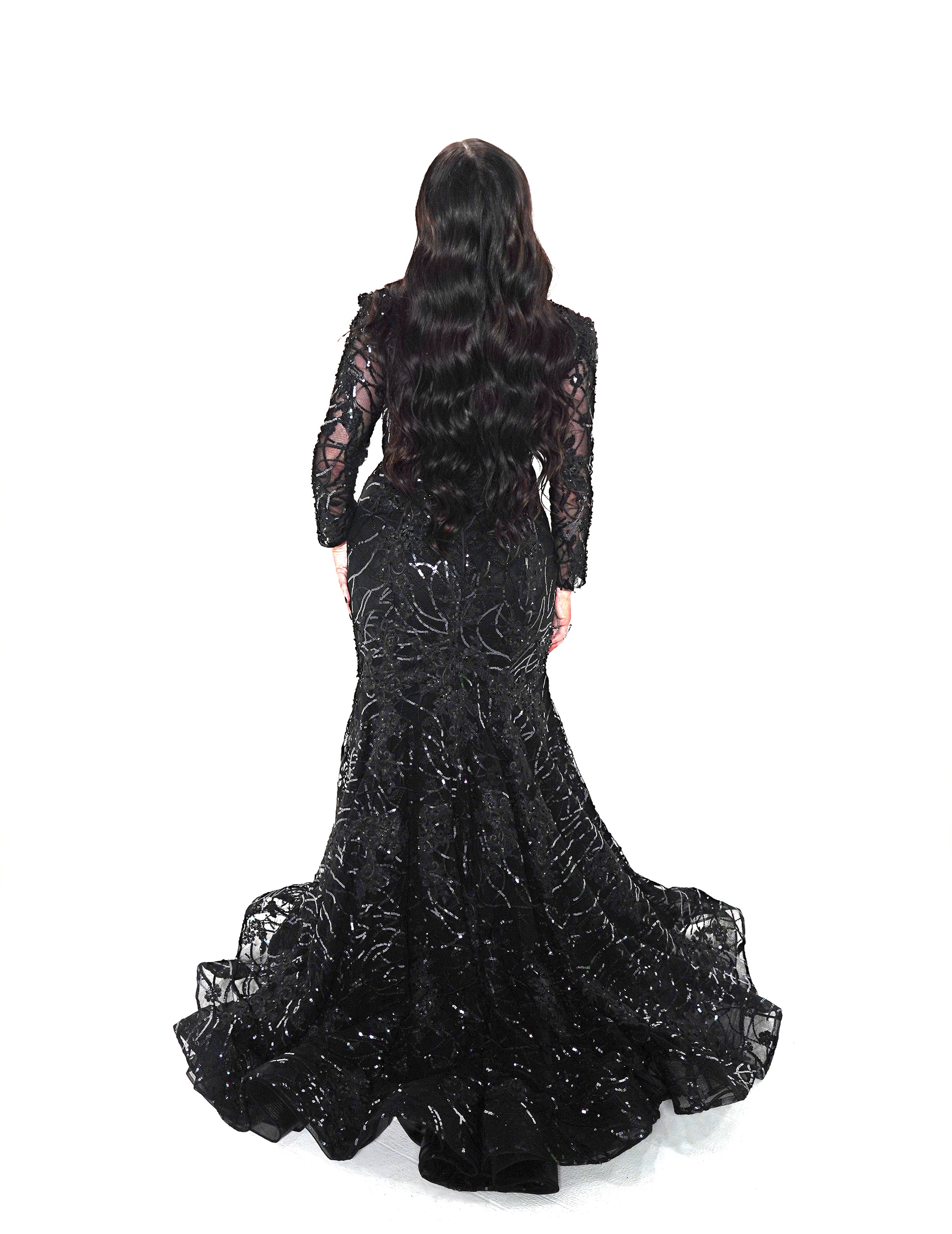 Back view of black mermaid gown with flared lace train and fitted silhouette