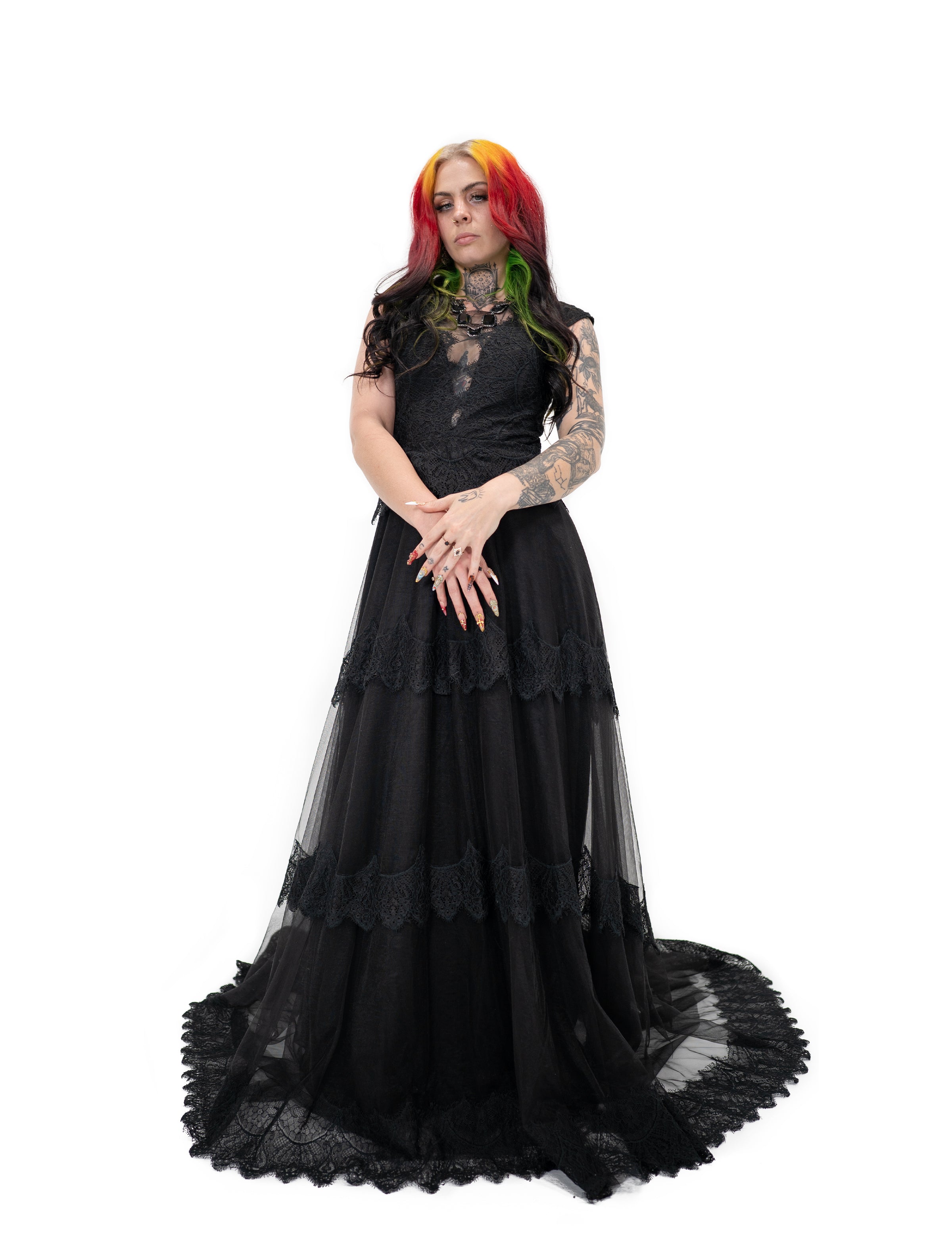 Bête Noire Devotion gown front view highlighting lace bodice, sheer details, and tiered black skirt