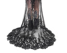 Close-up of the Kayla dress lace train with sheer tulle and detailed black floral appliqué