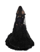 Back view of the Raven Veil by Bête Noire, a long black two-tier veil with lace details cascading down the gown