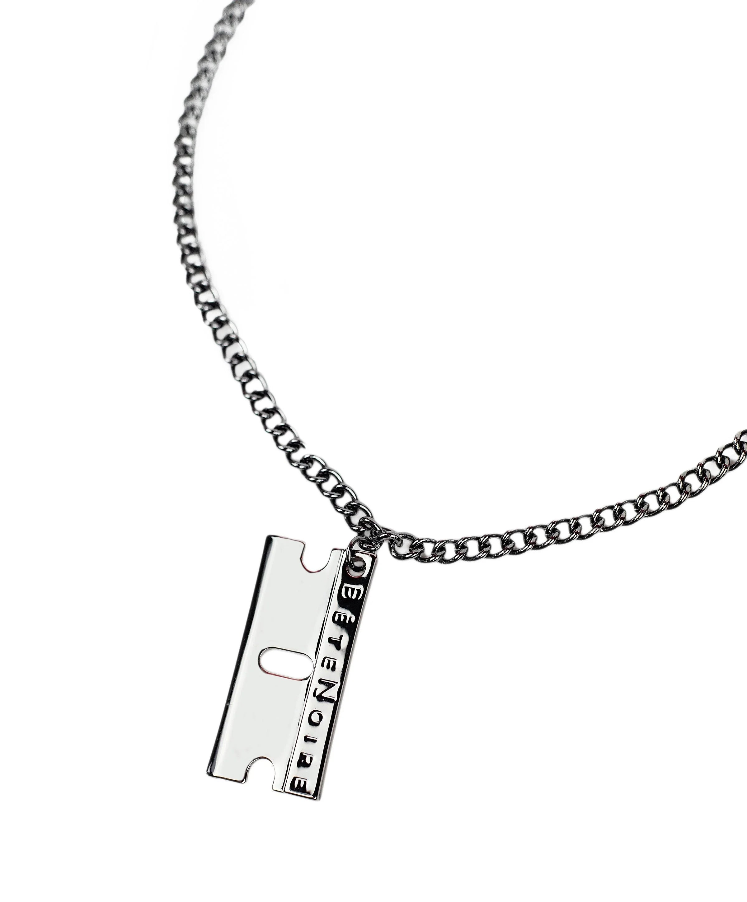 Close up of gunmetal razor blade pendant on Relentless Razor necklace