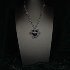 Close up of black gemstone Sacred Heart gothic necklace