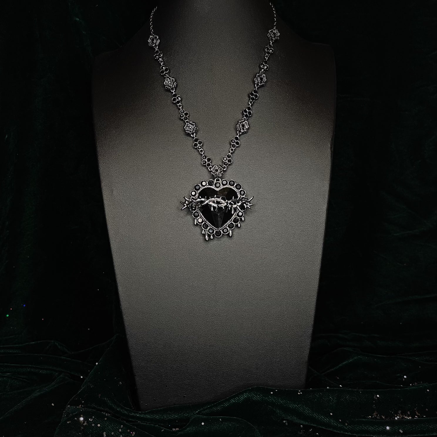 Close up of black gemstone Sacred Heart gothic necklace