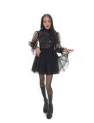 Vixen dress by Bête Noire with voluminous black tulle skirt and sheer long sleeves