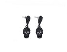 Black skull drop earrings styled for dark looks