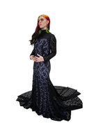 Side view of Evangeline gown by Bête Noire, black lace over purple underlay, long sleeve gothic gown with fitted shape and flared train