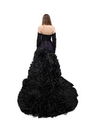 Alternative bridal gown in black and purple with corset back and full ruffled skirt train