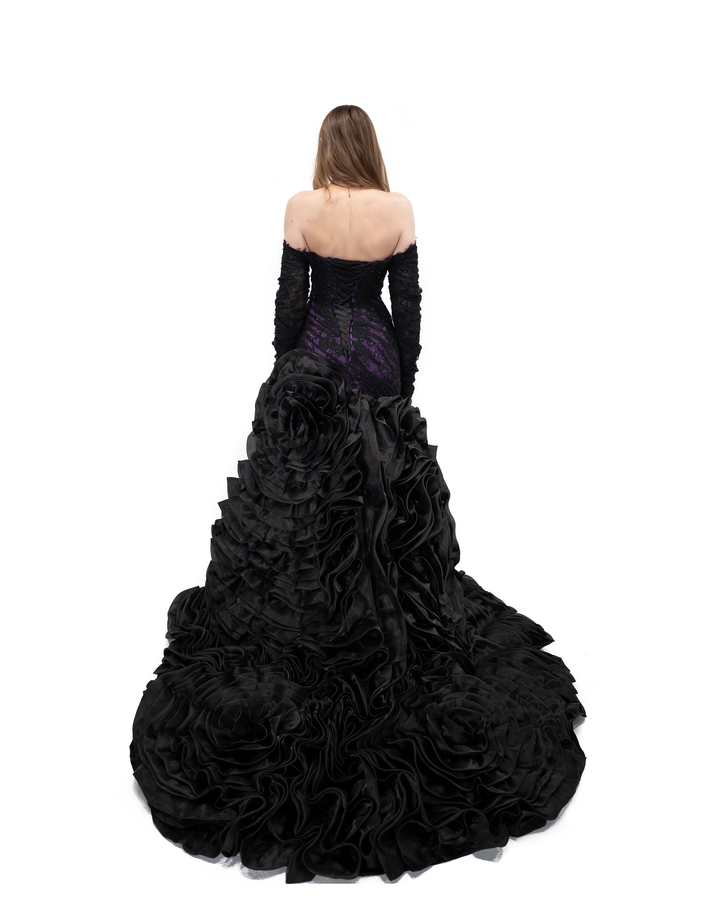 Alternative bridal gown in black and purple with corset back and full ruffled skirt train