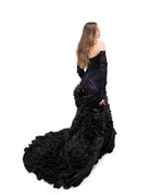 Gothic black wedding gown with layered ruffle train and dark purple underlay detail