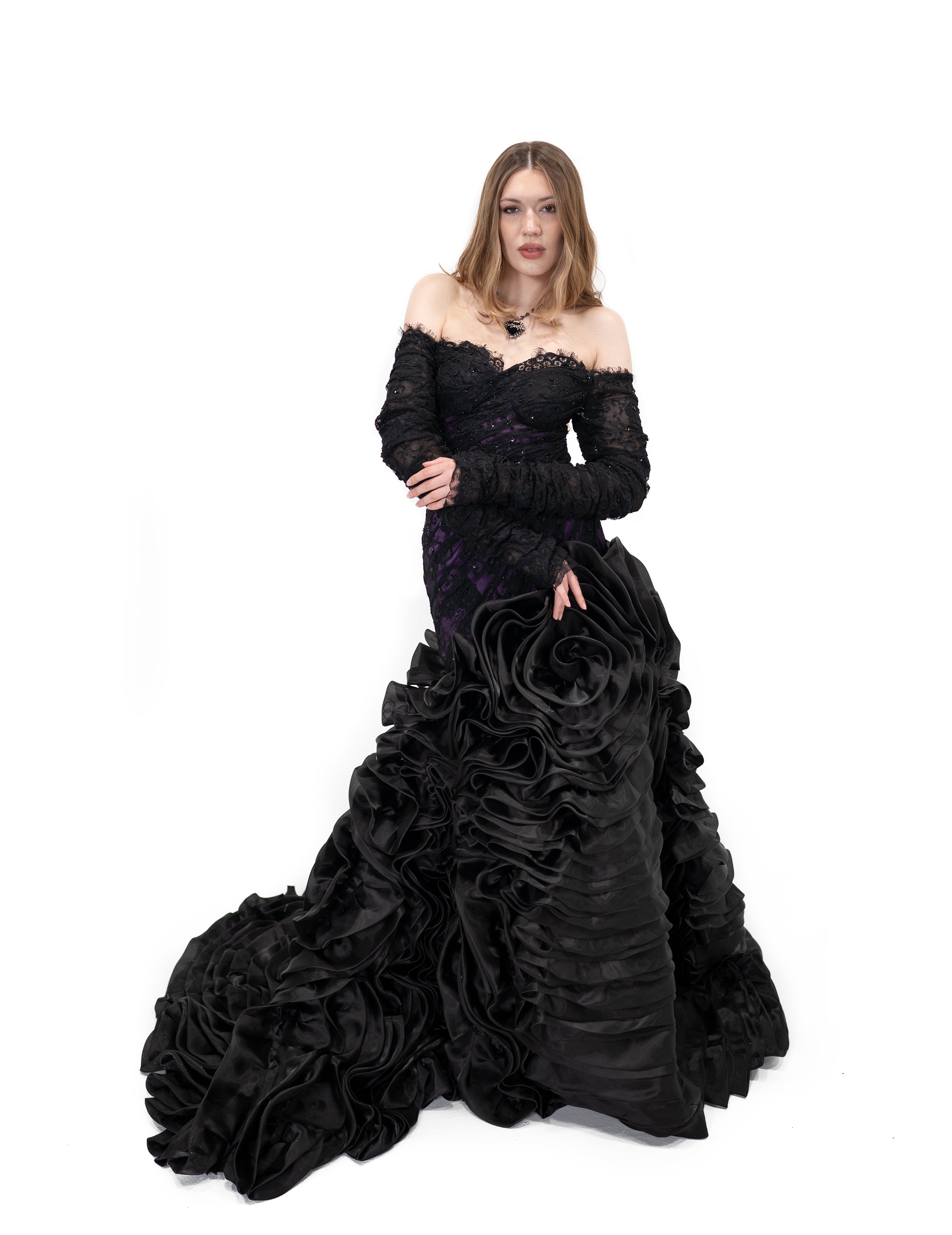 Black and dark purple gothic bridal gown with off-shoulder lace sleeves and dramatic ruffled skirt