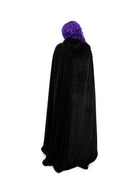 Back view of full length black velvet cape with fur trim and hood
