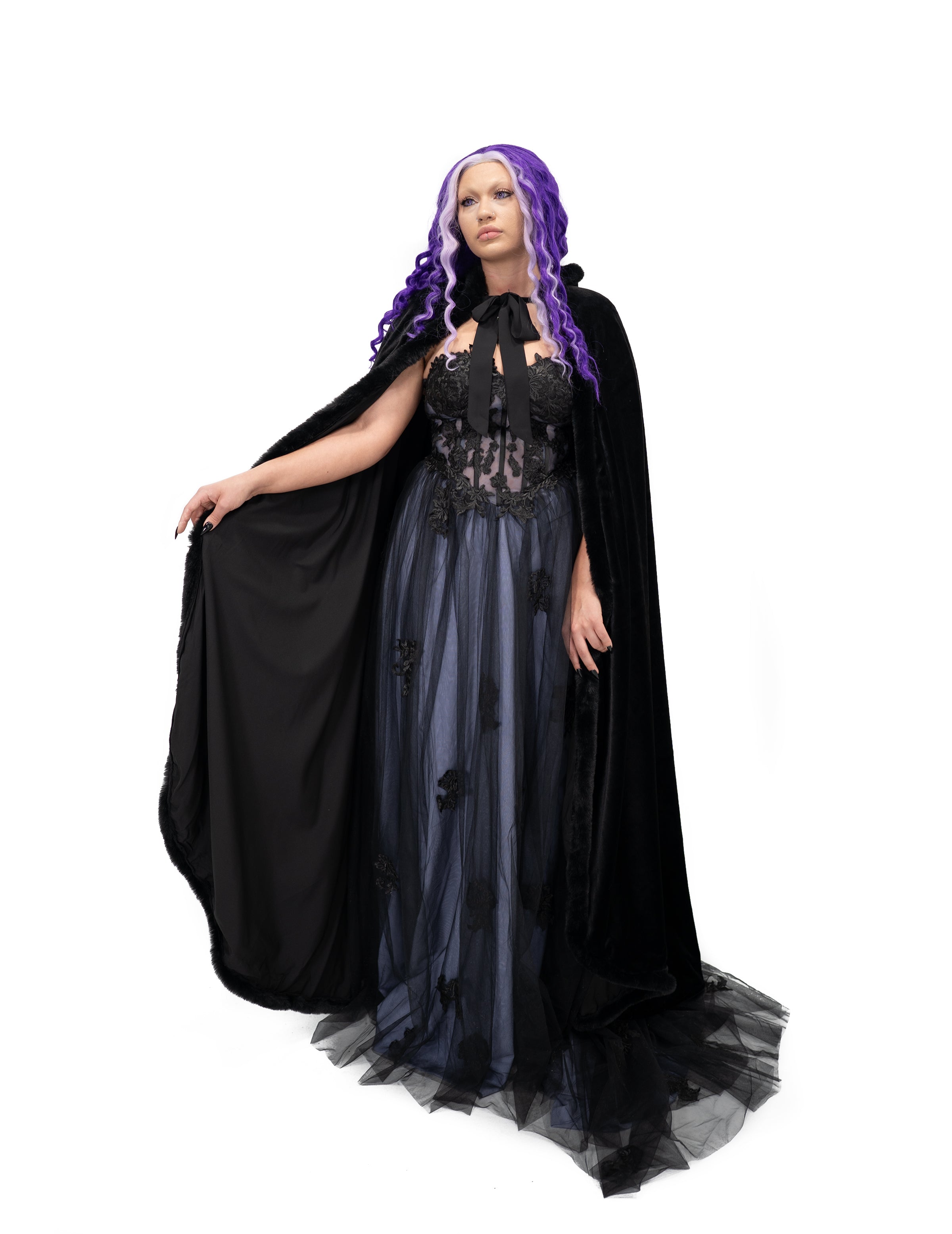 Black velvet gothic bridal cape with fur trim, worn open over lace gown, front view