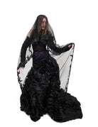 The Raven Veil by Bête Noire featuring two layers of black tulle with delicate lace trim and flowing silhouette