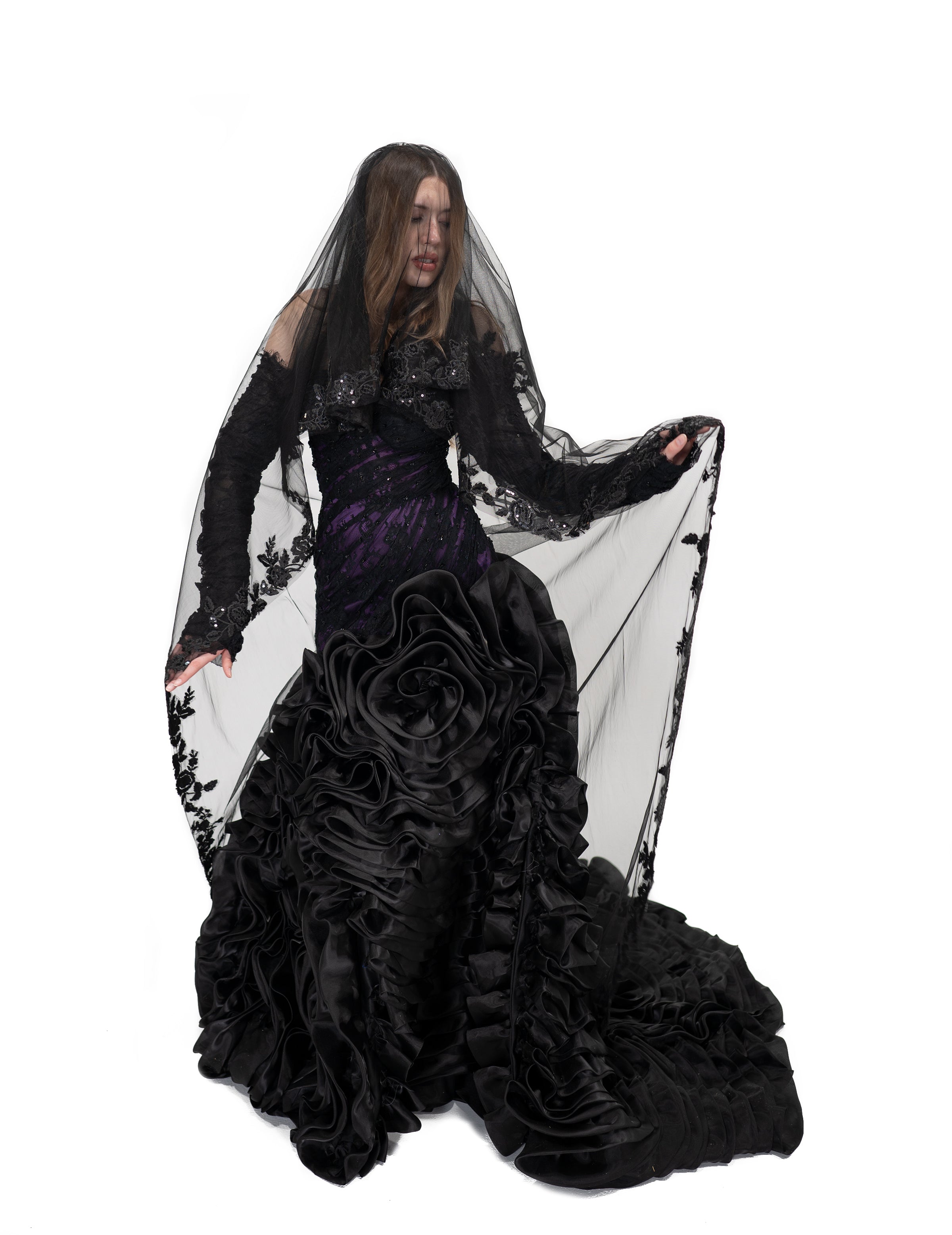 The Raven Veil by Bête Noire featuring two layers of black tulle with delicate lace trim and flowing silhouette