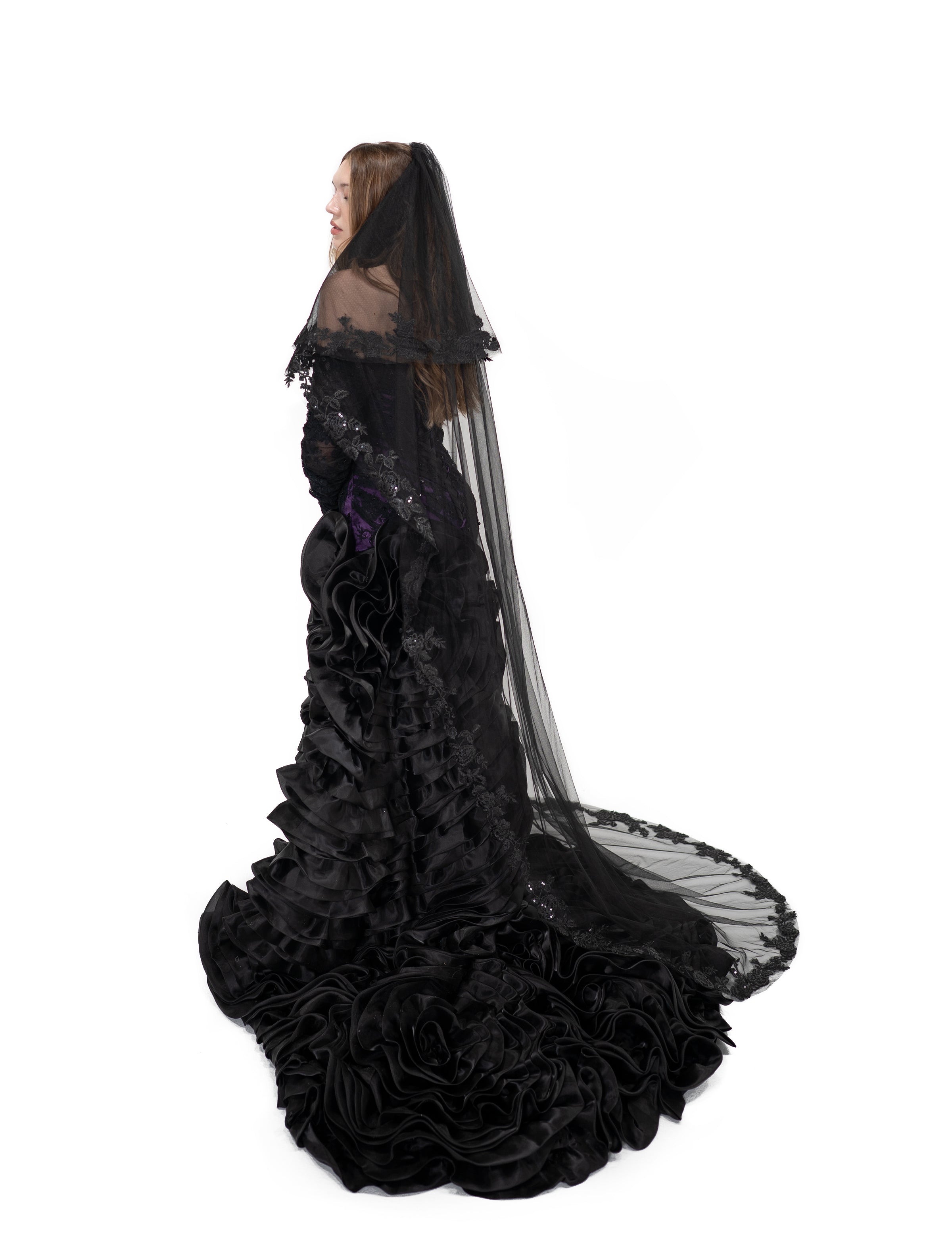 Side view of the Raven Veil by Bête Noire, a black two-tier gothic bridal veil with lace edging