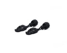 Black skull earrings with bold, statement design