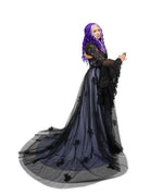 Side view of a black and soft purple tulle gothic wedding dress with a fitted corset bodice and full flowing skirt.